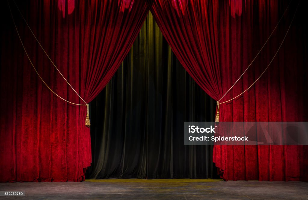 Red Theatre Curtain Red open theatre curtain with gold tassels agains a black curtain. Theatrical Performance Stock Photo