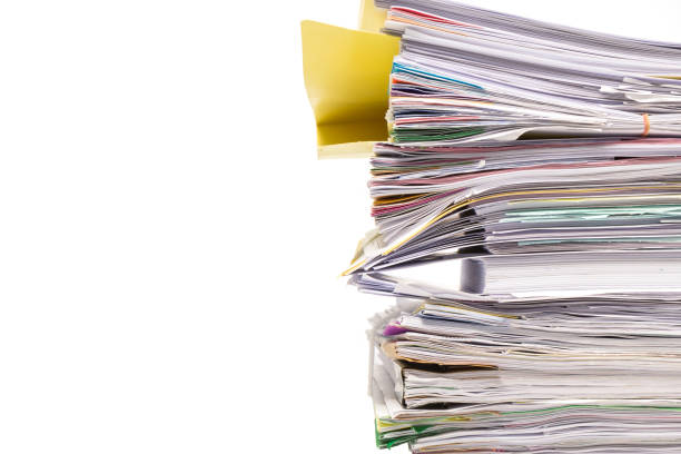 istock Stack of business papers isolated on white background 672273050