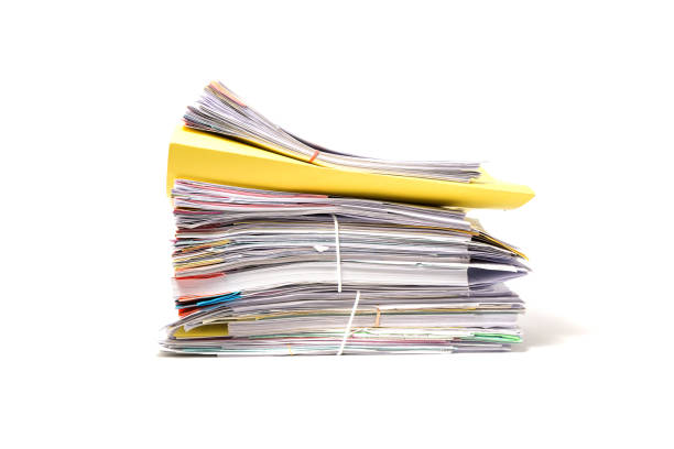 istock Stack of business papers isolated on white background 672273056