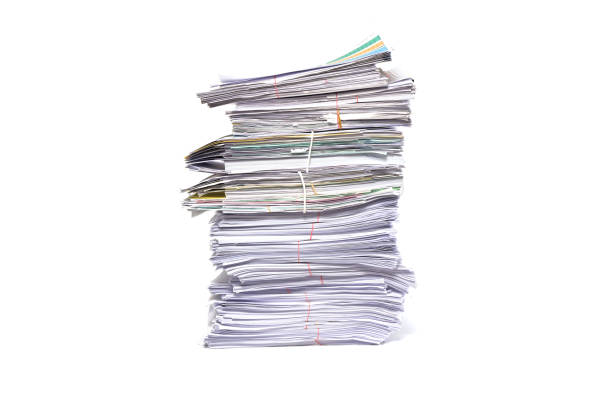 istock Stack of business papers isolated on white background 672273088