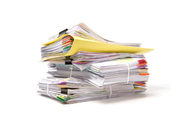 istock Stack of business papers isolated on white background 672273102