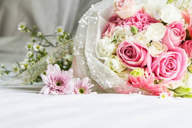 istock Bouquet on the bed in bedroom 672277834