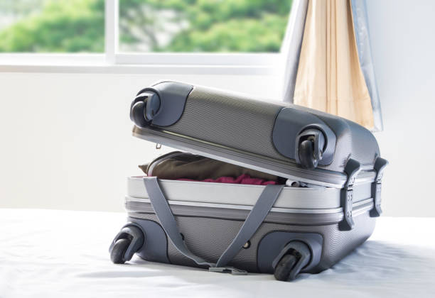 istock Luggage on the bed 672278560
