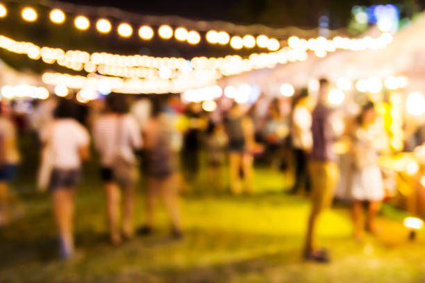 istock Abstract blurred lights of night market 672281762