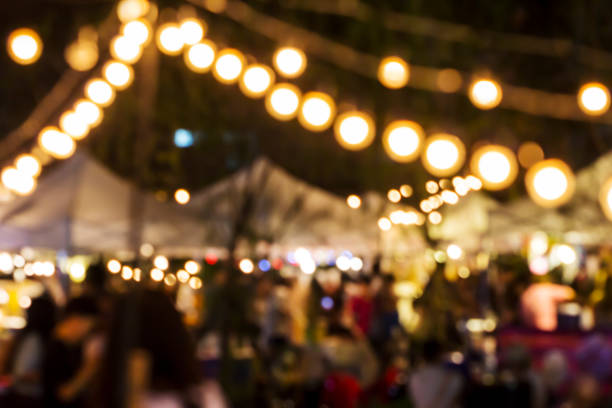 istock Abstract blurred lights of night market 672281796