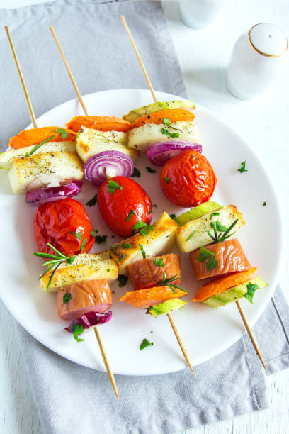 istock Grilled sausage and vegetables skewers 672284912