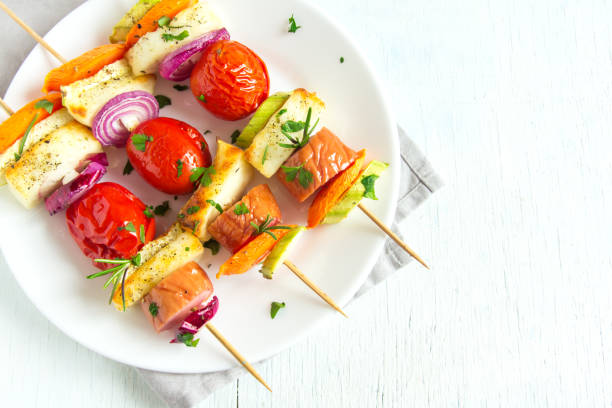 istock Grilled sausage and vegetables skewers 672284922