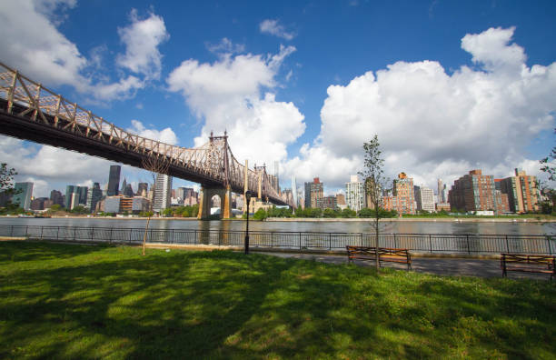 istock Queensboro bridge over the river and park, New York 672289092