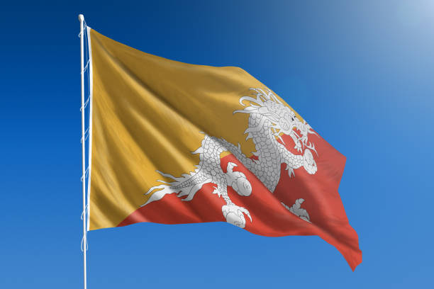 drapeau national du bhoutan sur claire ciel bleu - bhutanese flag photos et images de collection