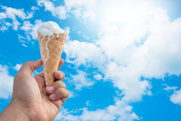 istock Ice cream melting in the summer day blue sky background. 672294652
