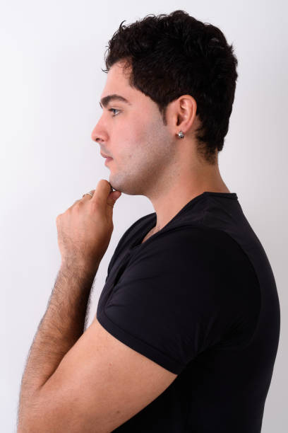 istock Profile view of Persian man thinking against white background 672297140