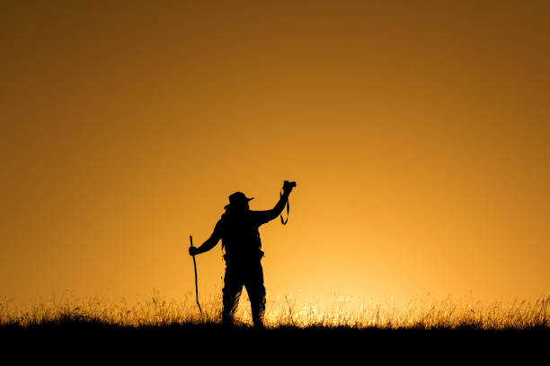 istock Silhouette Of People having fun at sunset time 672298002