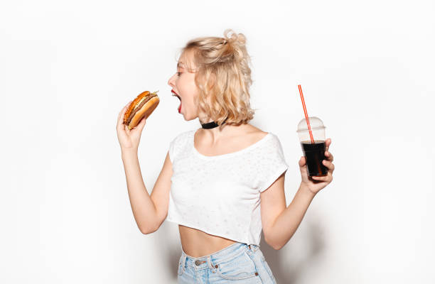 istock Woman with food and drink 672310108