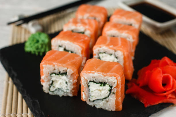 istock Appetizing uramaki salmon rolls. Japanese sushi. 672310202