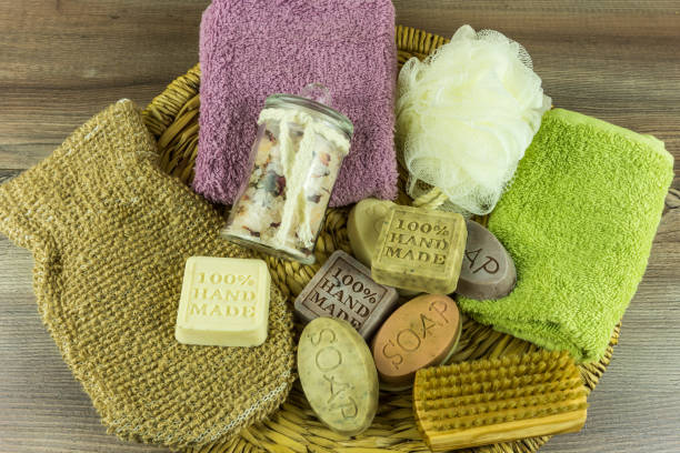 istock Various handmade soaps with many accessories on a wooden table 672312638