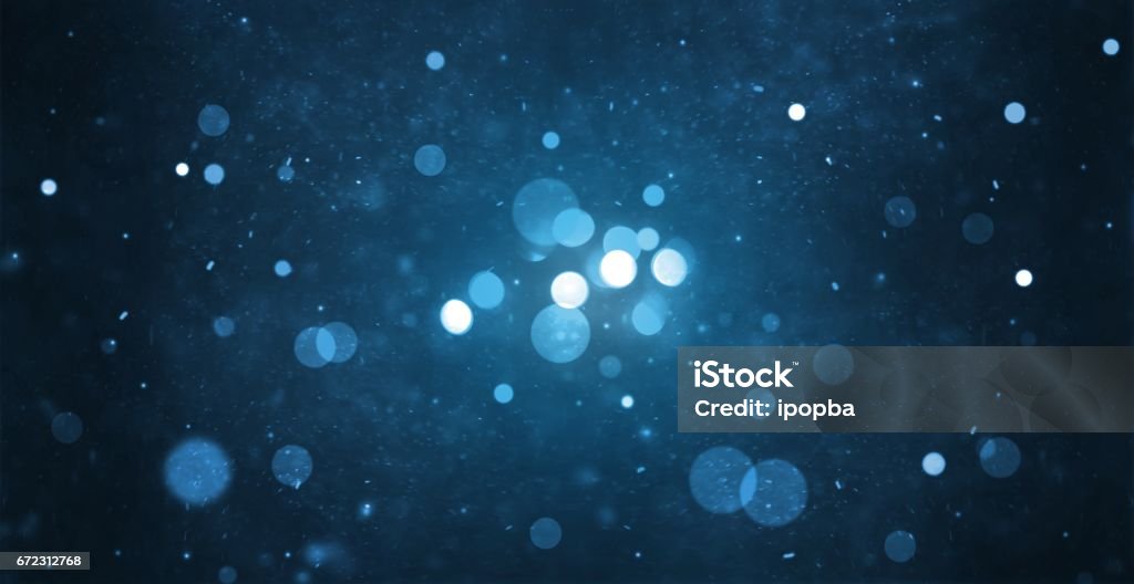 abstract particle bokeh with dark blue background Defocused Stock Photo