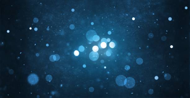 abstract particle bokeh with dark blue background abstract particle bokeh with dark blue background glowworm photos stock pictures, royalty-free photos & images