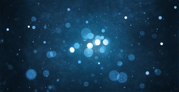 abstract particle bokeh with dark blue background abstract particle bokeh with dark blue background differential focus stock pictures, royalty-free photos & images