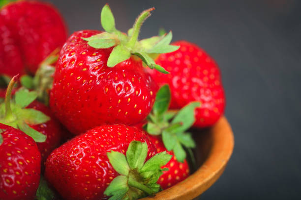 istock Ripe strawberries in a plate close-up. 672313970