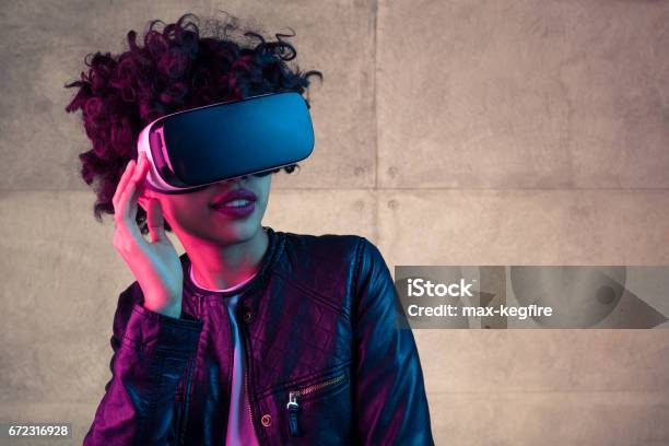 Young Stylish Girl In Vr Headset Stock Photo - Download Image Now - Virtual Reality Simulator, Virtual Reality, Expertise