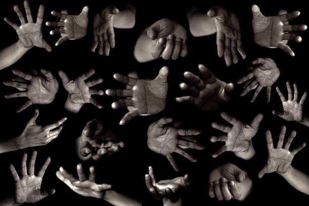istock Hands of woman isolated on black 672319982