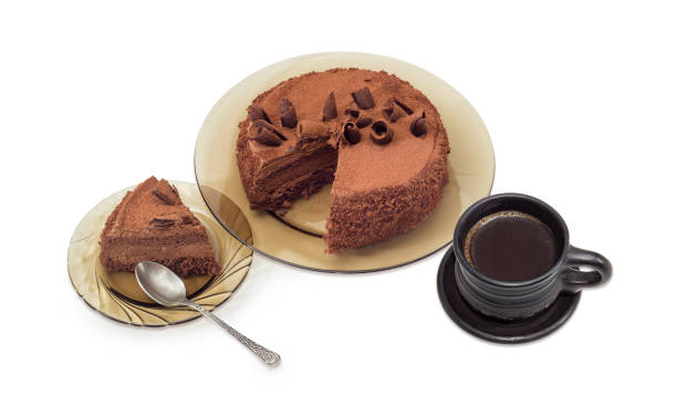 istock Partly sliced chocolate cake and black coffee 672320598