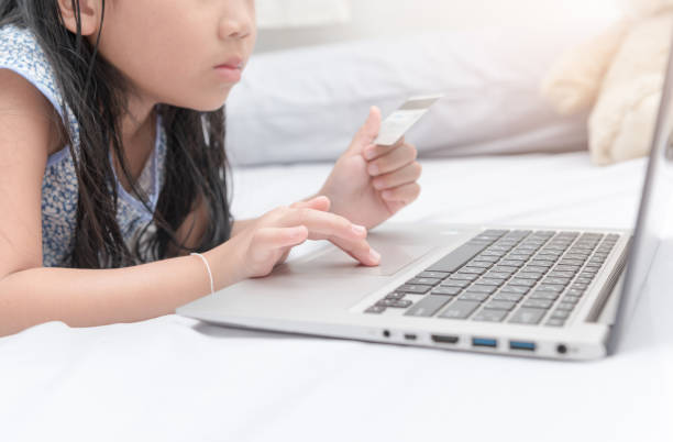 istock Online shopping.Hands holding credit card and using laptop. 672320766