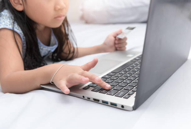 istock Online shopping.Hands holding credit card and push on enter button 672323172