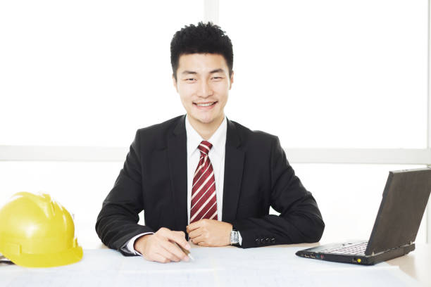 istock young asian businessman in modern office 672323486