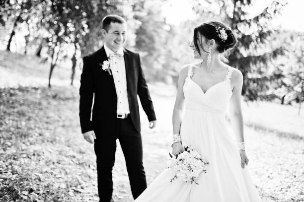istock Newly wed in their wedding day at park 672324880