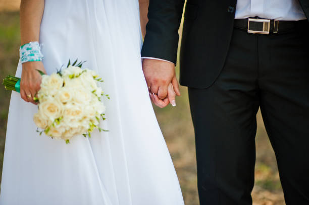 istock Newly wed in their wedding day at park 672325100