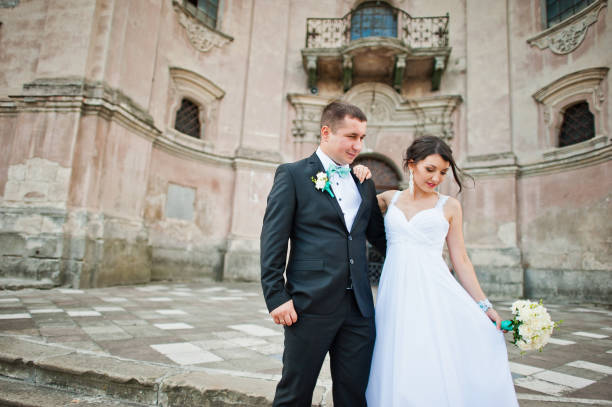 istock Just married couple background old church 672325370