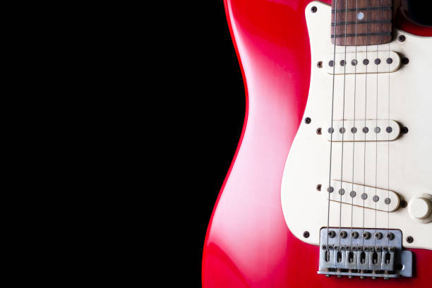 istock Close up of Electric guitar on black background. 672325536