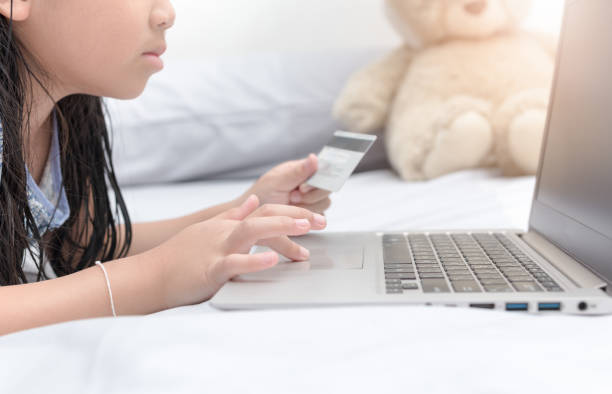 istock Online shopping.Hands holding credit card and using laptop. 672325602