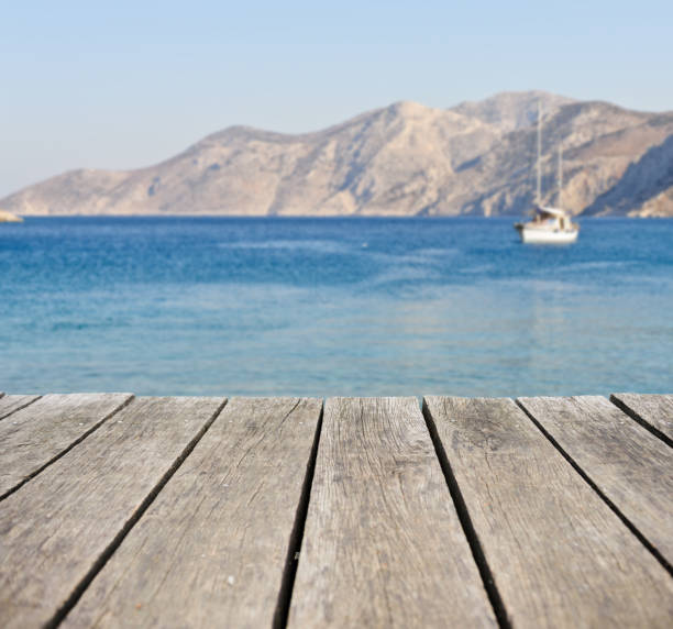 istock Wooden terrace with the beach view in summer 672330436
