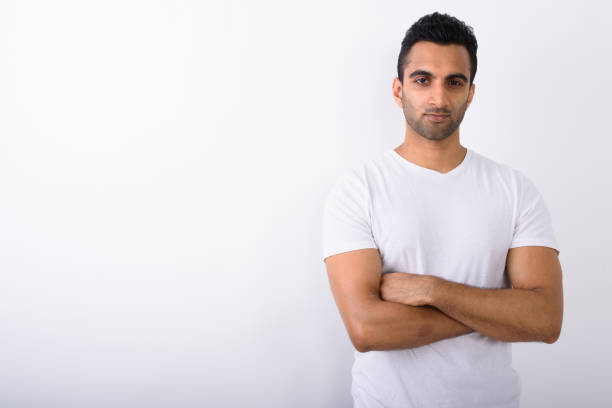 istock Studio shot of young handsome Indian man against white background 672331050