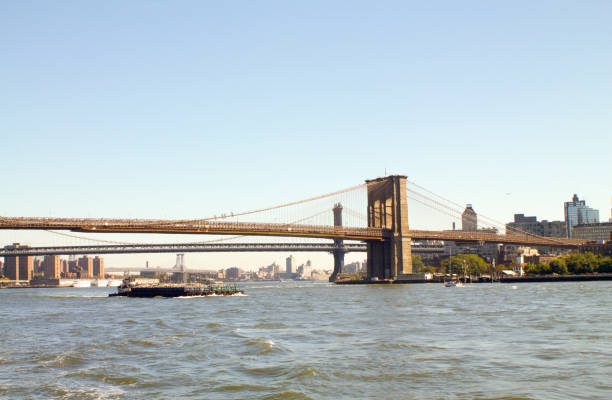istock Brooklyn  bridge in new York from a boat 672331088
