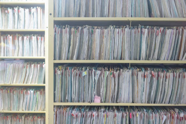istock Mixed information of old patient's data and library concept 672339156