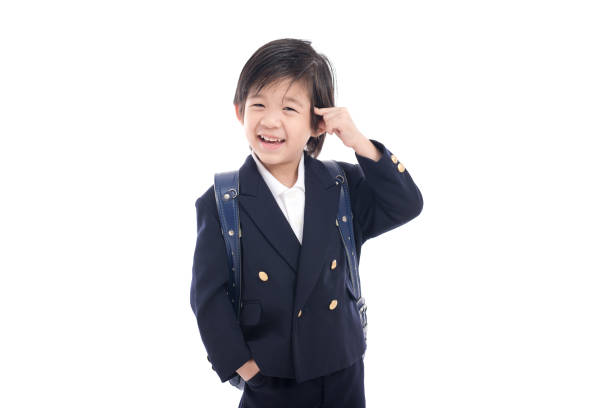 istock Asian child in school uniform with blue school bag 672343566