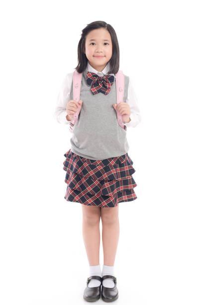istock Asian child in school uniform with pink school bag on 672343618