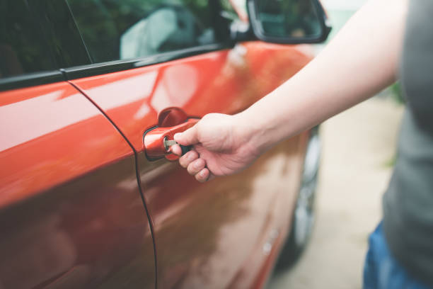 istock Asian man opening a car with key,transportation and ownership concept 672346730