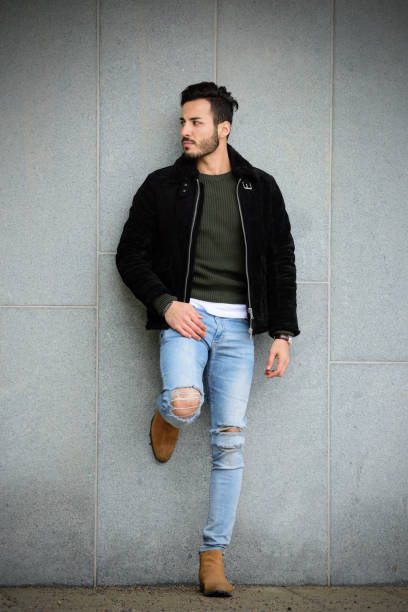istock Young man in beard, winter city, standing, waiting 672351356