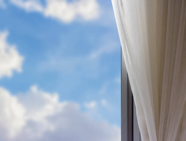 istock Airy curtain at window in the bedroom 672354172