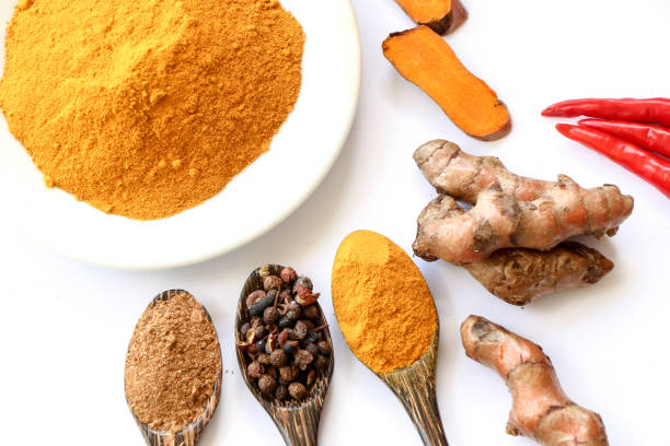 istock Turmeric roots with turmeric powder 672354558