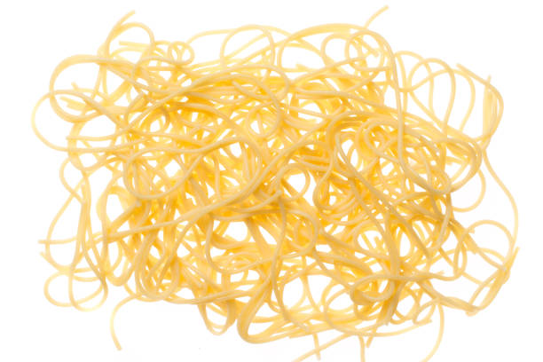 istock Spaghetti cooked suspended in the air, pasta in backlight, background 672357814