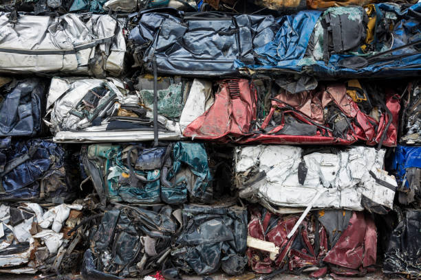 istock Cars in junkyard,  pressed and packed for recycling. 672358162