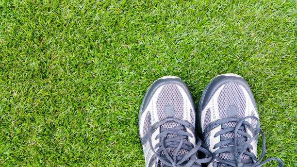 istock Sport shoes on artificial turf 672358468