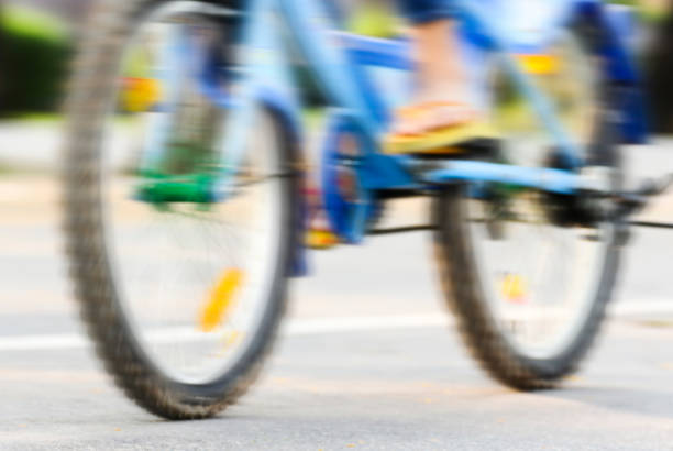 istock Motion blur of biker in a park 672358818