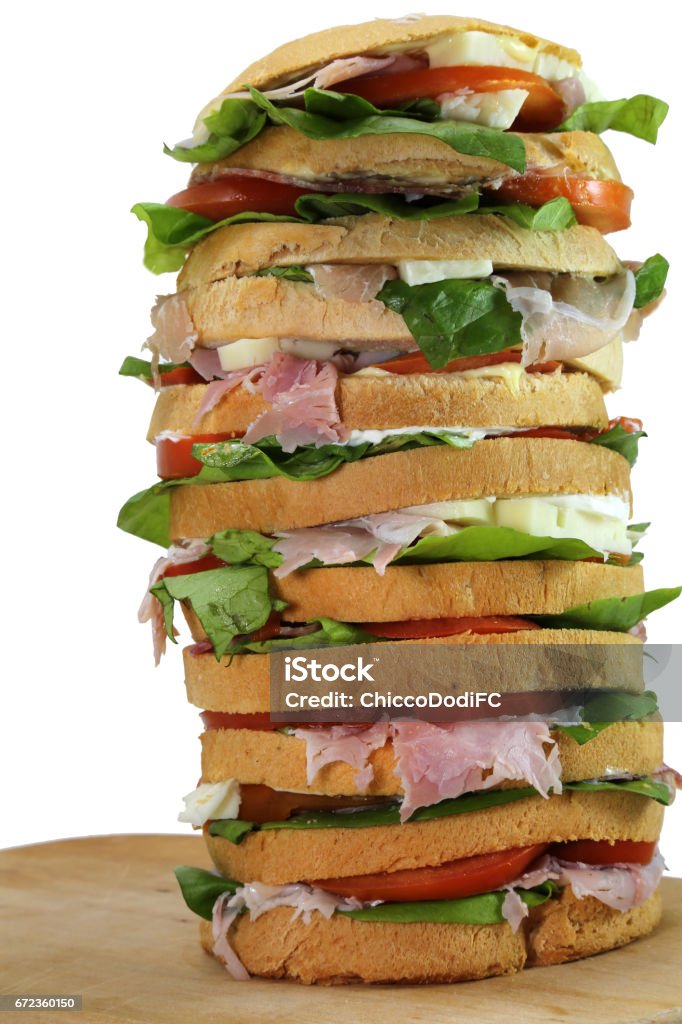 sandwich with cheese and ham and tomato and mayonnaise on a wood big sandwich with cheese and ham and tomato and mayonnaise on a wooden cutting board called gastronomic panettone in italian cuisine Tall - High Stock Photo sandwich with cheese and ham and tomato and mayonnaise on a wood big sandwich with cheese and ham and tomato and mayonnaise on a wooden cutting board called gastronomic panettone in italian cuisine Tall - High Stock Photo