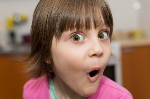 istock Beautiful Surprised Little Young Girl 672362610